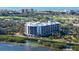 Aerial view of the condo, highlighting its waterfront location and proximity to a golf course at 2110 Harbourside Dr # 522, Longboat Key, FL 34228