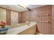 Guest bathroom with updated vanity and patterned wallpaper at 2110 Harbourside Dr # 522, Longboat Key, FL 34228