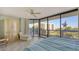 Spacious bedroom with a king bed and stunning water views from the balcony at 2110 Harbourside Dr # 522, Longboat Key, FL 34228