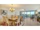 Dining area with a wooden table and chairs, near the living room at 2110 Harbourside Dr # 522, Longboat Key, FL 34228