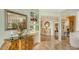 An entryway with decorative furniture and mirrors reflecting light at 2110 Harbourside Dr # 522, Longboat Key, FL 34228