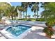 Relaxing hot tub with lush tropical landscaping at 2110 Harbourside Dr # 522, Longboat Key, FL 34228