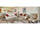 Open living area with comfortable seating and a view into the kitchen at 2110 Harbourside Dr # 522, Longboat Key, FL 34228