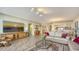 Open concept living room with a view of the kitchen and dining area at 2110 Harbourside Dr # 522, Longboat Key, FL 34228
