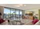 Spacious living room with water views and large TV at 2110 Harbourside Dr # 522, Longboat Key, FL 34228