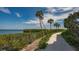 Peaceful waterfront nature trail with lush landscaping at 2110 Harbourside Dr # 522, Longboat Key, FL 34228
