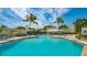Sparkling community pool with surrounding patio at 2110 Harbourside Dr # 522, Longboat Key, FL 34228