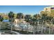 Resort-style pool with palm trees and lounge chairs at 2110 Harbourside Dr # 522, Longboat Key, FL 34228