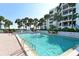 Inviting swimming pool with surrounding patio at 2110 Harbourside Dr # 522, Longboat Key, FL 34228