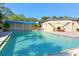 Sparkling blue pool with surrounding patio at 2110 Harbourside Dr # 522, Longboat Key, FL 34228