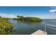 Tranquil waterfront view with lush vegetation at 2110 Harbourside Dr # 522, Longboat Key, FL 34228