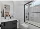 Modern bathroom with a tub/shower combo and floating vanity at 2456 Missara Ln, Sarasota, FL 34231