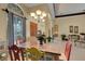 Well-lit dining area with a rustic table and chairs at 2500 Farms Ct, Sarasota, FL 34240