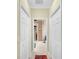 Walkthrough bathroom with double closets and access to shower and toilet at 25067 Palisade Rd, Punta Gorda, FL 33983