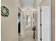 Bright hallway with neutral decor and carpet flooring at 25067 Palisade Rd, Punta Gorda, FL 33983