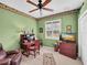 Bright home office features built-in desk, comfortable seating, and large window at 25067 Palisade Rd, Punta Gorda, FL 33983