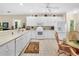 Well-equipped kitchen boasting white cabinetry and modern appliances at 25067 Palisade Rd, Punta Gorda, FL 33983