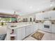 Spacious kitchen with a breakfast bar and view of the backyard at 25067 Palisade Rd, Punta Gorda, FL 33983