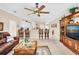 Open living room with a view of the kitchen and breakfast bar at 25067 Palisade Rd, Punta Gorda, FL 33983