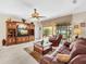 Spacious living room with built-in shelving and access to the backyard at 25067 Palisade Rd, Punta Gorda, FL 33983
