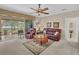 Relaxing living room with leather furniture and sliding doors to the patio at 25067 Palisade Rd, Punta Gorda, FL 33983