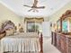 Main bedroom with king bed and access to private patio overlooking water at 25067 Palisade Rd, Punta Gorda, FL 33983