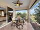 Enjoy the view from this screened porch with patio furniture at 25067 Palisade Rd, Punta Gorda, FL 33983