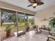 Spacious screened porch with seating and backyard access at 25067 Palisade Rd, Punta Gorda, FL 33983