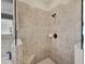 Large walk-in shower with tiled walls and built-in seat at 25067 Palisade Rd, Punta Gorda, FL 33983