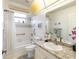 Clean bathroom, featuring a shower/tub combo and granite countertop at 2720 S Biscayne Dr, North Port, FL 34287