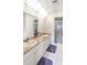 Bathroom with double vanity, granite countertop, and shower at 2720 S Biscayne Dr, North Port, FL 34287