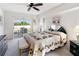 Bedroom with a queen-size bed and sliding door to patio at 2720 S Biscayne Dr, North Port, FL 34287