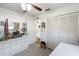 Well-lit bedroom with built-in storage and a large closet at 2720 S Biscayne Dr, North Port, FL 34287