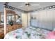 Bedroom with a four-poster bed, dresser, and window at 2720 S Biscayne Dr, North Port, FL 34287