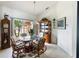 Bright dining room with glass-top table and wicker chairs at 2720 S Biscayne Dr, North Port, FL 34287