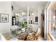 Casual dining area with glass-top table and wicker chairs at 2720 S Biscayne Dr, North Port, FL 34287