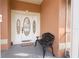 Ornate front door with sidelights and a decorative bench at 2720 S Biscayne Dr, North Port, FL 34287