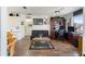 Gathering room with wood floors, leather sofa, and built-in desk at 2720 S Biscayne Dr, North Port, FL 34287