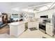 Spacious kitchen featuring stainless steel appliances and an island at 2720 S Biscayne Dr, North Port, FL 34287
