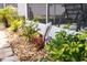 Landscaped area with decorative rocks, plants, and pelican statue at 2720 S Biscayne Dr, North Port, FL 34287
