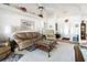 Spacious living room with comfortable seating and access to the dining area at 2720 S Biscayne Dr, North Port, FL 34287