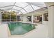 Inviting screened pool area with spa and ample patio space at 2797 Harvest Dr, Sarasota, FL 34240