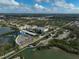 Aerial view of community, marina, and surrounding area at 304 Pine Run Dr, Osprey, FL 34229