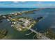 Aerial view showing waterfront property and bridge access at 304 Pine Run Dr, Osprey, FL 34229