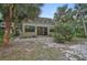 Ground level patio with private backyard and lush landscaping at 304 Pine Run Dr, Osprey, FL 34229