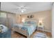 Relaxing bedroom with a ceiling fan and plenty of natural light at 304 Pine Run Dr, Osprey, FL 34229