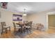 Bright dining room with wooden table and hardwood floors at 304 Pine Run Dr, Osprey, FL 34229