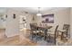 Bright dining room with wooden table and hardwood floors at 304 Pine Run Dr, Osprey, FL 34229