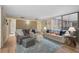 Bright living room with hardwood floors, comfy seating, and a cozy atmosphere at 304 Pine Run Dr, Osprey, FL 34229