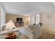 Comfortable living room with sofas, TV, and fireplace at 304 Pine Run Dr, Osprey, FL 34229